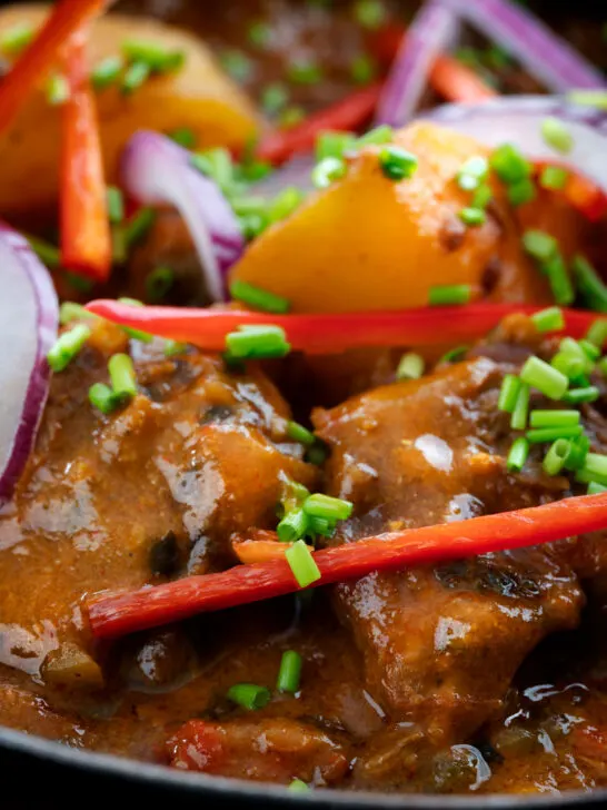 Close-up Pakistani aloo gosht meat and potato curry.