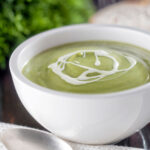 Creamy broccoli and stilton soup with a swirl of cream.