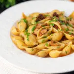 Chicken thigh and chorizo sausage pasta served with garlic bread.