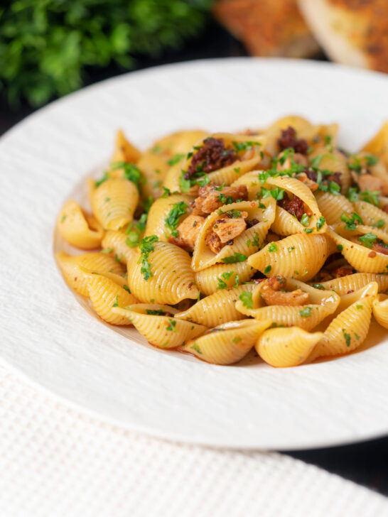 Chicken thigh and chorizo sausage pasta served with garlic bread.