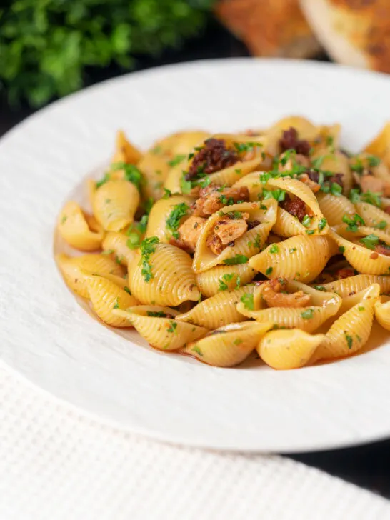 Chicken thigh and chorizo sausage pasta served with garlic bread.