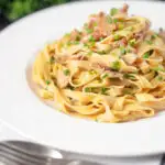 Chicken and mushroom tagliatelle with fresh chives.