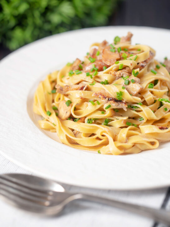 Chicken and mushroom tagliatelle with fresh chives.