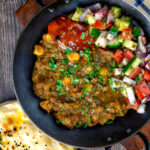 Overhead Indian-inspired chickpea and lentil curry with kachumber salad and mango chutney featuring a title overlay.