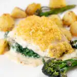 Cod mornay with a cheesy sauce and breadcrumb topping served with potatoes and broccoli.