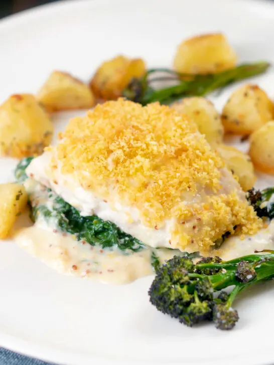 Cod mornay with a cheesy sauce and breadcrumb topping served with potatoes and broccoli.