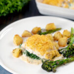 Baked Cod mornay with a breadcrumb topping served with potatoes and broccoli.