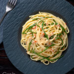 Overhead crab linguine pasta with chilli and samphire featuring a title overlay.