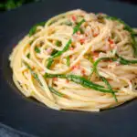 Crab linguine pasta with chilli and samphire featuring a title overlay.