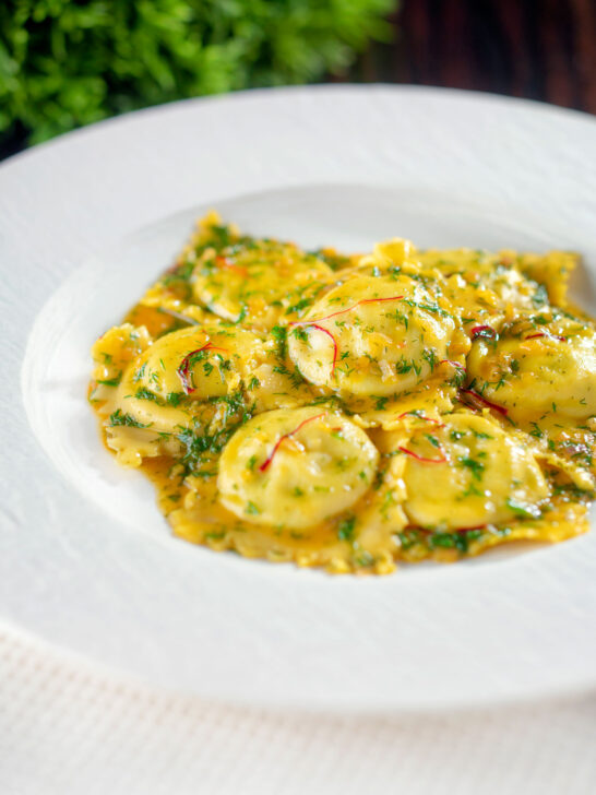 Crab and ricotta ravioli with a saffron and dill butter sauce.