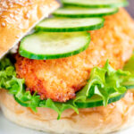 Crispy chicken breast fillet sandwich with cucumber and lettuce.