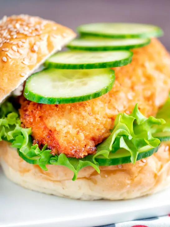 Crispy chicken breast fillet sandwich with cucumber and lettuce.