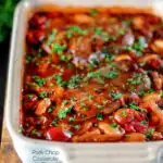 Pork chop casserole with cherry tomatoes and beans in a casserole dish featuring a title overlay.