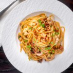 Overhead prawn and chorizo pasta with linguine.