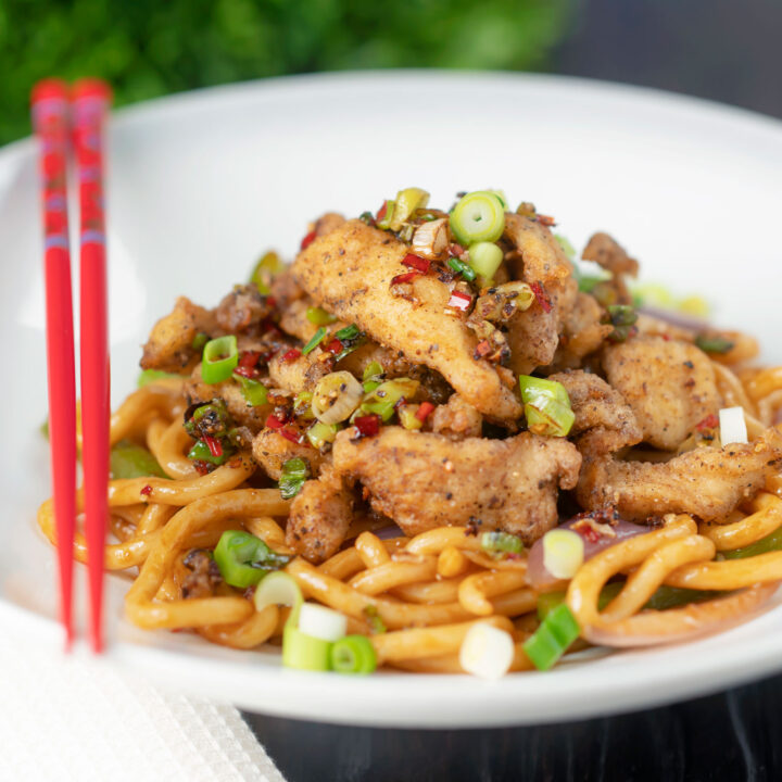 Chinese takeaway style salt and pepper chicken served with noodles.