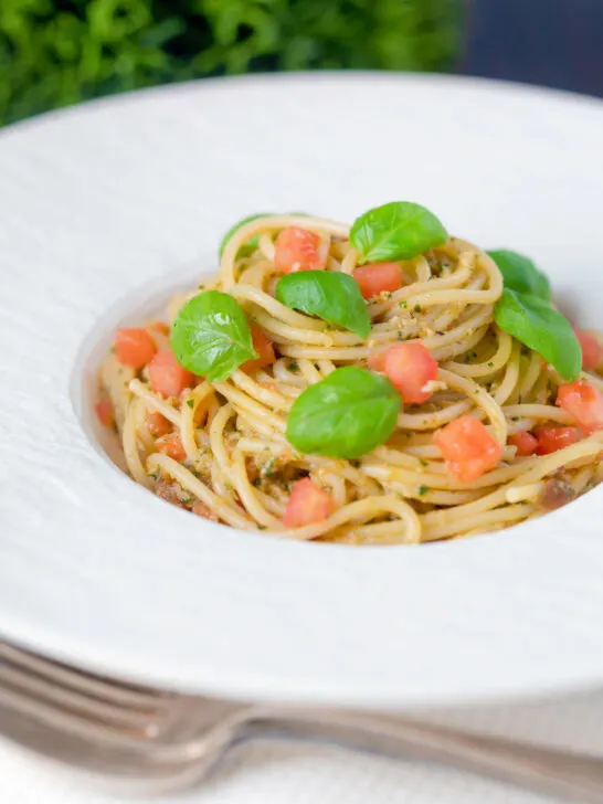 Pasta pesto alla trapanese with spaghetti, fresh tomato and basil.