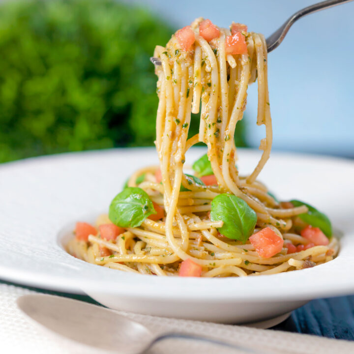 Sicilian pasta pesto all trapanese with tomato concasse and fresh basil.