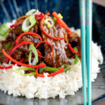 Stir-fried beef steak in oyster sauce with fresh chilli and rice.