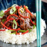 Stir-fried beef steak in oyster sauce with fresh chilli and rice.