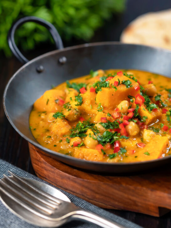 Vegan sweet potato and chickpea curry with coconut milk and fresh coriander.
