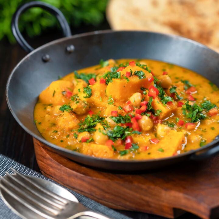 Indian-influenced vegan sweet potato and chickpea curry with coconut milk.