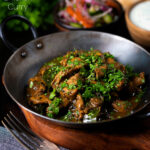 Tamil black pepper chicken curry, aka Chettinad chicken with naan and salad featuring a title overlay.