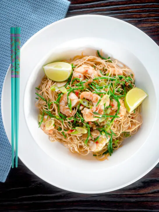 Overhead Thai influenced prawn stir fry with samphire and egg noodles.