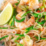 Close-up Thai influenced prawn stir fry with samphire and egg noodles.