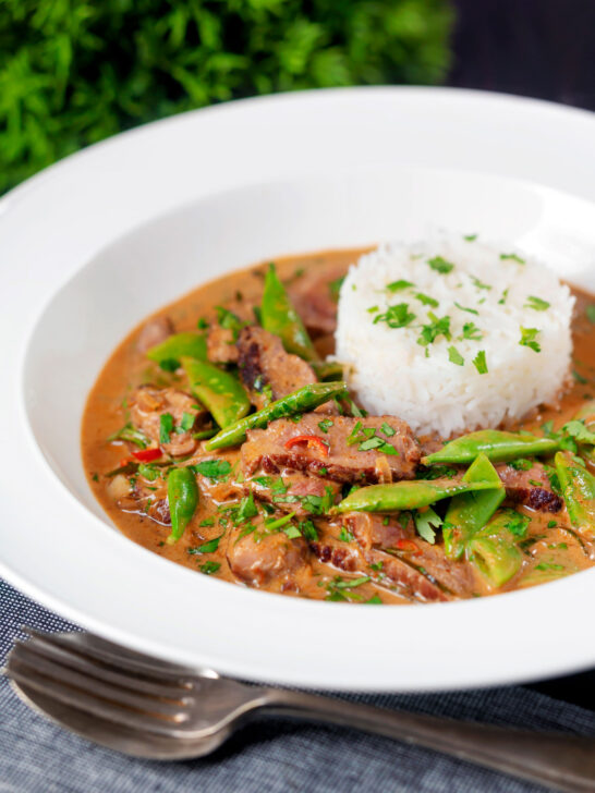 Thai red beef curry with sugar snap peas and coconut milk sauce.