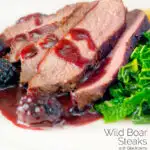 Close-up wild boar haunch steak with blackberry sauce, cabbage and mashed potato featuring a title overlay.