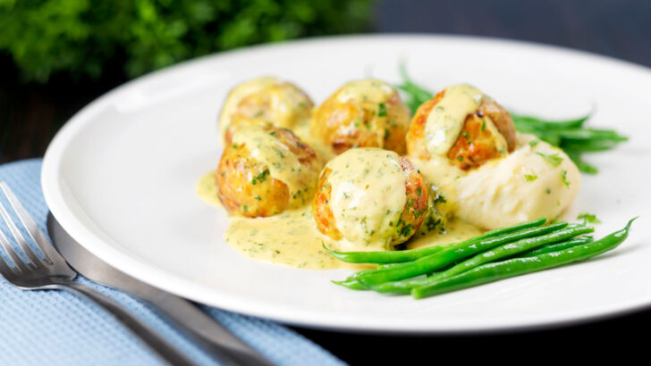 Chicken meatballs with creamy honey mustard sauce, green beans and mashed potato.