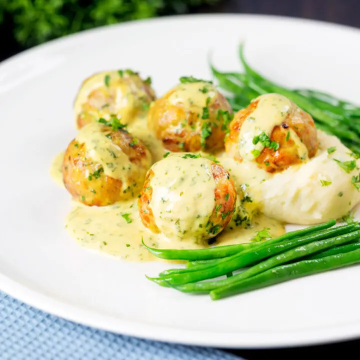 Chicken meatballs with creamy honey mustard sauce, green beans and mashed potato.