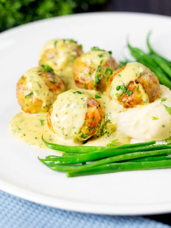 Chicken meatballs with honey, mustard sauce and mashed potato.