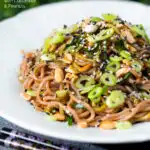 Easy soba noodle salad with cucumber, toasted peanuts and sesame seeds featuring a title overlay.