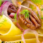 Close-up fennel and orange pappardelle with red onions and pecan nuts featuring a title overlay.