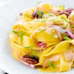 Fennel and orange pasta with red onions and pecan nuts.