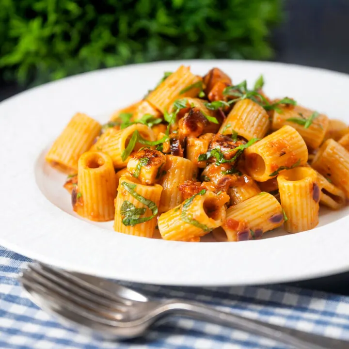 Halloumi and red sun-dried tomato pesto pasta with fresh basil.