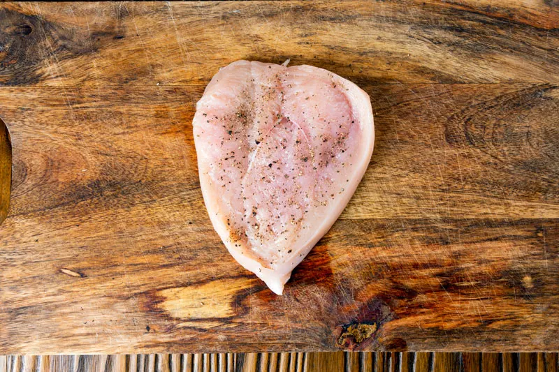 Salt and pepper seasoned butterflied chicken breast.