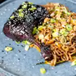 Hoisin baked duck legs with soba noodle salad.