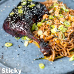 Hoisin baked duck legs with soba noodle salad featuring a title overlay.
