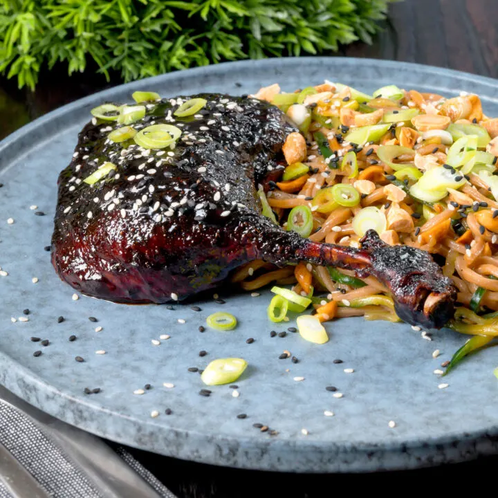 Sticky roast hoisin duck leg served with soba noodle salad.