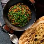 Overhead keema matar, a lamb or mutton mince and pea curry featuring a title overlay.