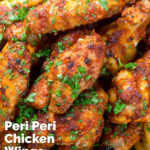 Spicy peri peri chicken wings featuring a title overlay.