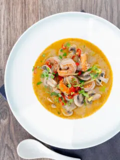 Overhead creamy Thai prawn tom yum soup.