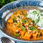 Vegan satay sweet potato curry with a coconut milk sauce.
