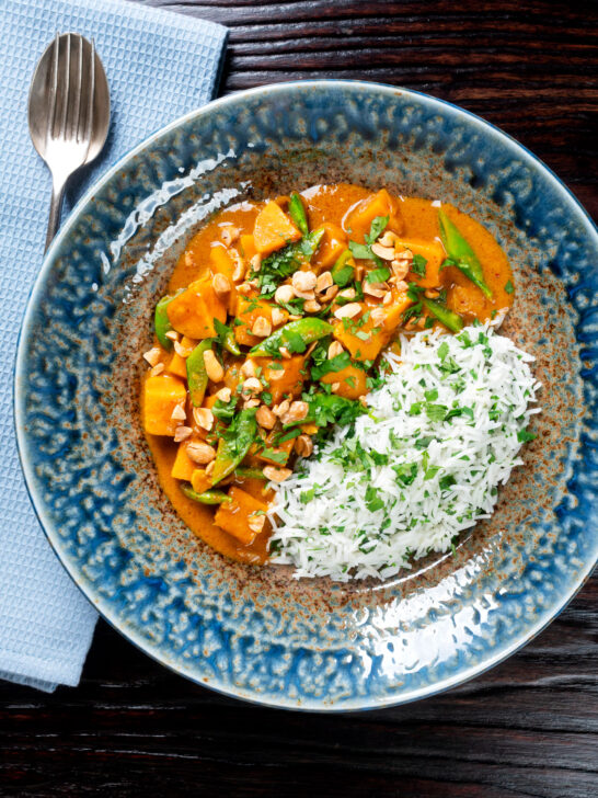 Overhead vegan satay sweet potato curry with a coconut milk sauce.