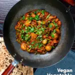 Overhead vegan vegetable bhuna Indian curry served in a wok featuring a title overlay.