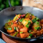 Vegan vegetable bhuna Indian curry served a naan bread featuring a title overlay.