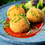 Air fryer cooked arancini with an easy tomato sauce and fresh basil..