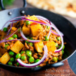 Aloo keema or Indian minced beef, pea and potato curry with red onion featuring a title overlay.